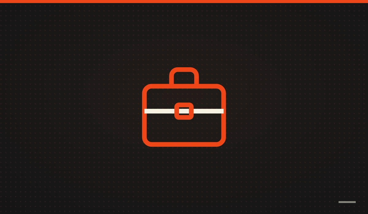 Maletín de trabajo naranja sobre fondo negro: web para autónomos